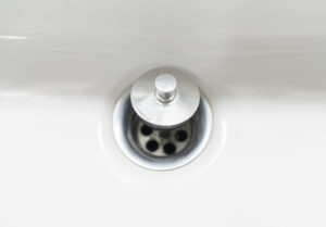 A shower drain with the drain plug. Make sure to keep your drains clear to avoid slow drains.