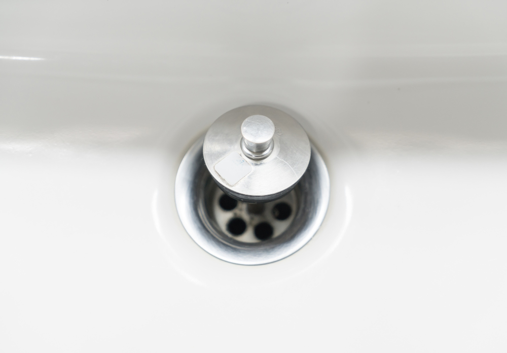 A shower drain with the drain plug. Make sure to keep your drains clear to avoid slow drains.