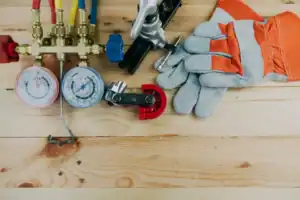 %Imagetitle% | Perfect Plumbing, Heating &Amp; Air A selection of HVAC tools, from gauges and gloves to a pipe cutter and wrenches, neatly displayed by Perfect Plumbing, Heating & Air.